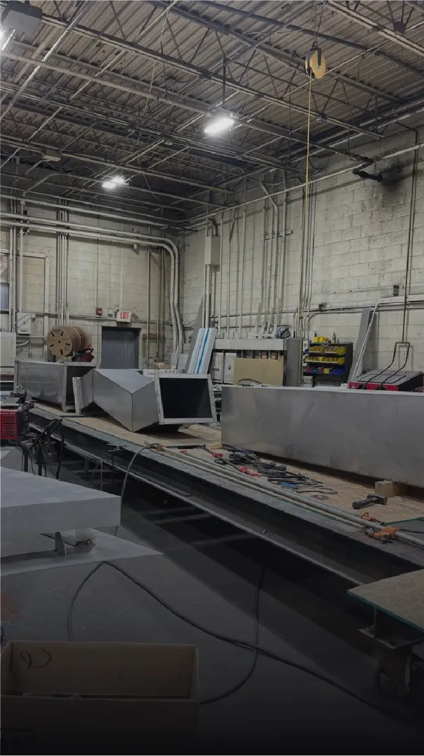 Industrial workspace with metal fabrication equipment.